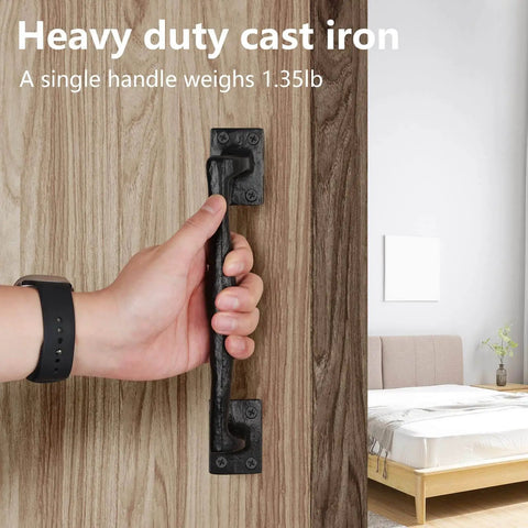 Nine and Three Quarters Inch Rustic Cast Iron Gate Handle for Sliding Barn Doors Vintage Metal Gate Pull held on a wooden door