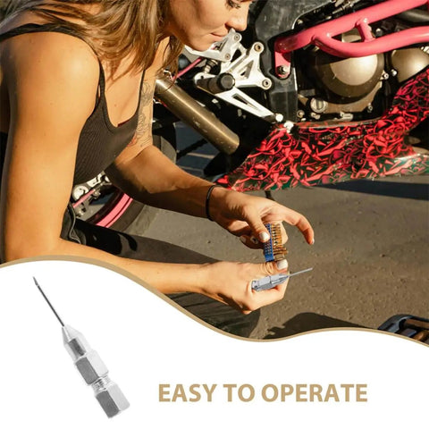 Woman using Grease Needle Nozzle Kit Two Piece Leakproof Fittings For Precision Lubrication Sealed Bearings on motorcycle maintenance