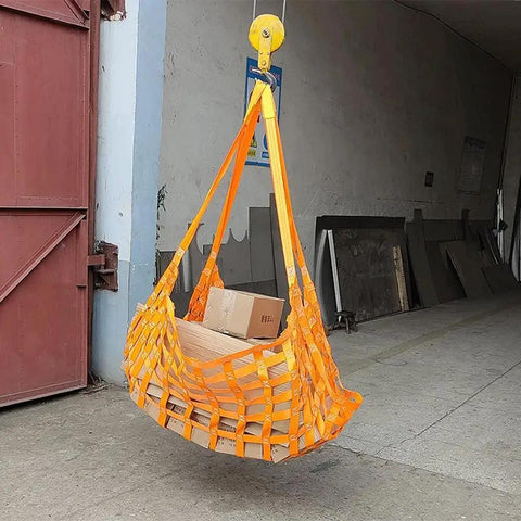 Flat Nylon Sling Hoisting Net For Heavy Load Rigging With 10cm Mesh lifting boxes in a warehouse.