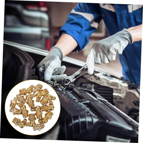 Mechanic using a 60-piece grease fitting assortment kit with 1/4-28 SAE-LT copper threaded lubrication nozzles on vehicle engine