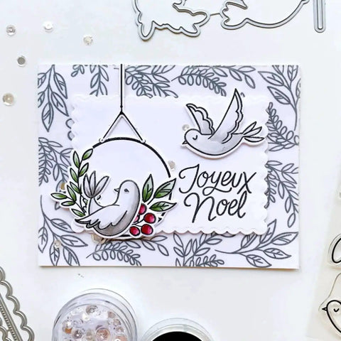 Handmade card with birds, holly, and 'Joyeux Noel' text using Rectangle Frame Metal Die Cuts Set With Scalloped Edges And Stitched Nesting Tags.