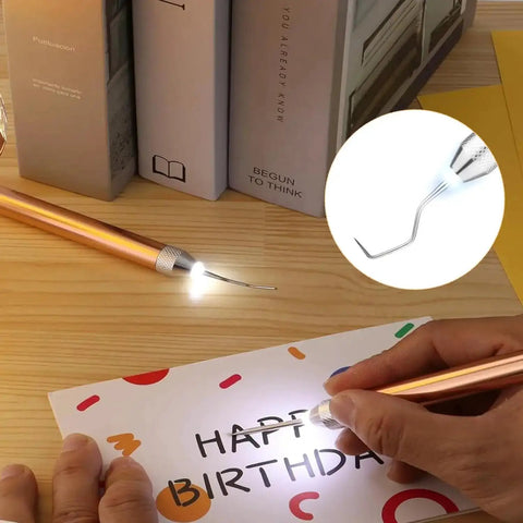 Person using a lighted vinyl weeding tool from the Lighted Vinyl Weeding Tools Set 3 Piece Pin And Hook Led Pen for crafting
