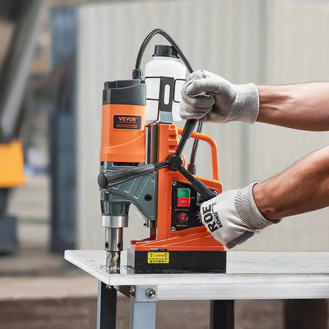 Person using a Heavy Duty Magnetic Drill Press With 1450W Motor, 0-800 RPM, 2 In Boring Capacity, Portable Electric Mag Drill by VEVOR.