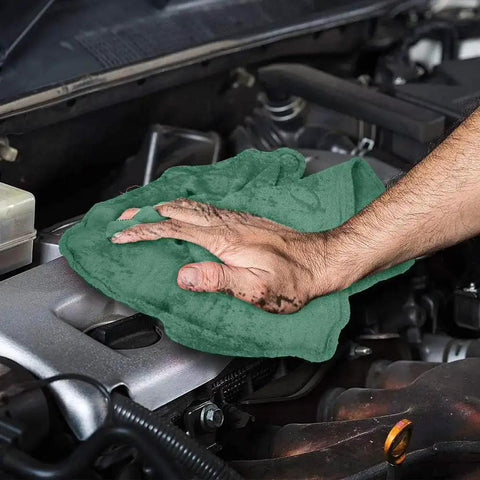 Person using Heavy Duty Shop Towels 50 Pack Green Terry Cloth Rags For Car Detailing And Home Cleaning Highly Absorbent Reusable Washable Towels on engine