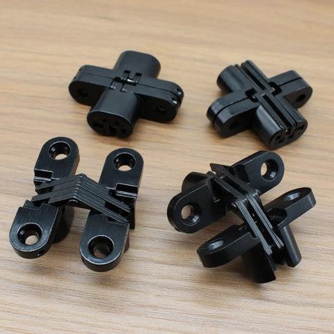 Hidden Hinge Set For Doors And Cabinets Lamvbls Stainless Steel 180 Degree Invisible Cross Hinges Black, set of 4 on wood surface.