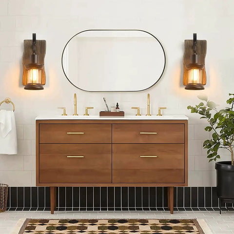 Bathroom with set of two rustic industrial wall sconces in black metal with wood backplate farmhouse indoor lighting above vanity.