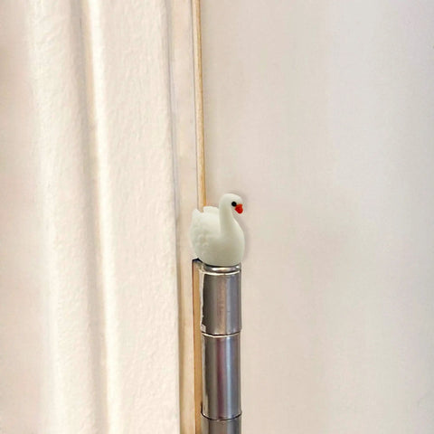 Whimsical Mini Swan Hinge Head Magnets Set Of 6 For Door Decor And Metal Surfaces installed on hinge pin