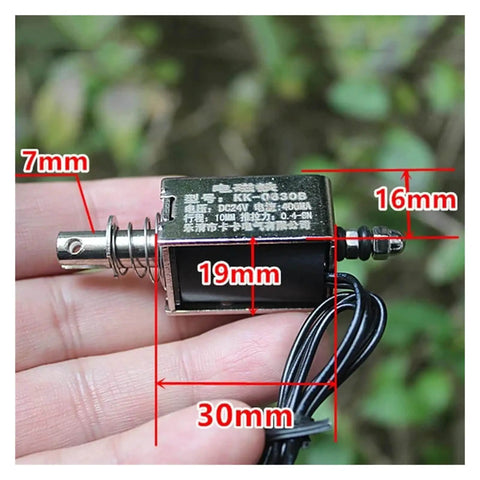 Beefy 24V DC Linear Solenoid Push Pull Magnet Actuator With Open Frame Design held in hand showing dimensions