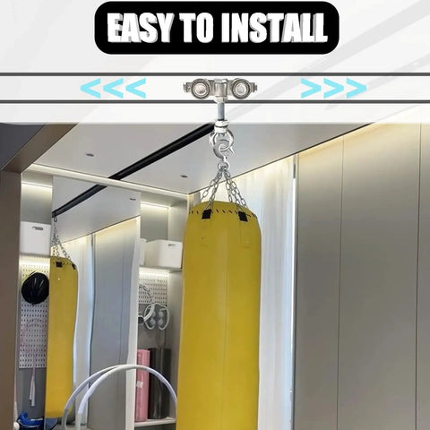 Heavy Duty Four Wheel Trolley Assembly Rollers For 1-5/8 Inch Wide Strut Channels And Taller Galvanized Carbon Steel attached to ceiling with a yellow punching bag on chains