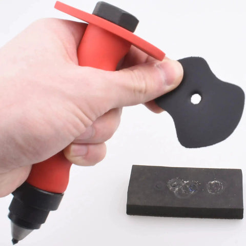 Hand holding Pro Grade Leather Punch Set with 13 Hollow Punch Heads for Clean Holes and Gaskets, showcasing punch shaft and ABS case