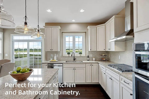 Modern kitchen with white cabinets, large windows, island, and decorative lighting, showcasing Full Overlay European Soft Close Cabinet Hinges.