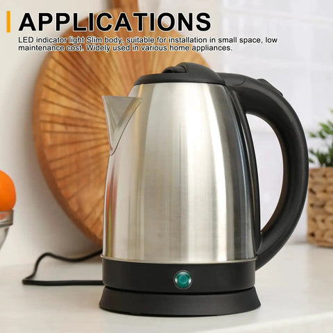 Stainless steel electric kettle with black handle on kitchen counter