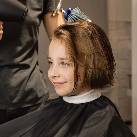 All In One Barber Cape Kit With Neck Duster Brush And Cleaning Brush For Salon Or Home Use Black Must Have Pro Grade Hair Cutting Accessories Designed For Quick Cleanups With Snap Closure Durable Fabric And Easy Wash being used during haircut