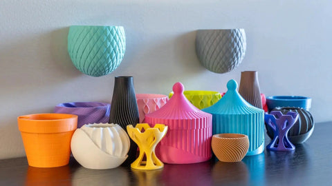 Colored 3D printed objects made with Panchroma Matte PLA Filament Charcoal Black 1.75mm 1kg For FDM Printers.
