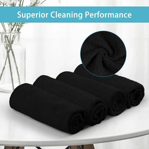 Premium Microfiber Cleaning Cloths 150 Pack 11.5 By 11.5 Inches Lint Free Streak Free Soft Rags rolled black towels on table.