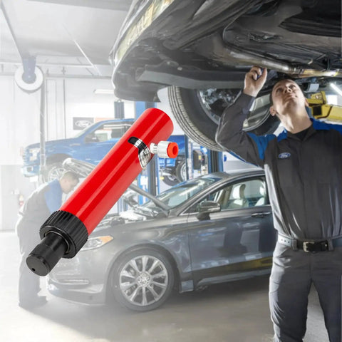 10 Ton Hydraulic Floor Jack Pump Portable Ram For Auto Body And Frame Repair in a workshop setting with cars