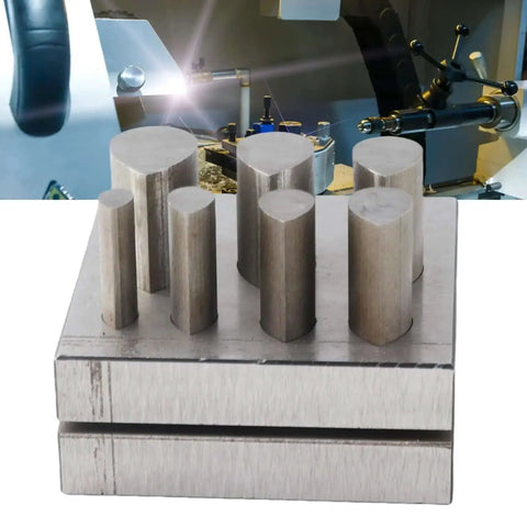 Drop Shape Disc Cutter Set In 45 Steel For Jewelry Making on a workbench, showing 7 dies with flat bottom for precise metal cutting.