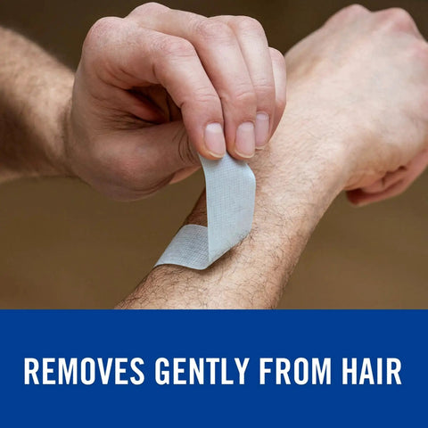 Person removing Strong Hold Pain Free Tape For Sensitive Skin 1 Roll 1 In X 4 Yds Silicone from arm hair