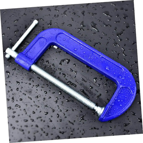 Blue Beefy Heavy Duty 6-Inch G Clamps For Woodworking And Metalworking on wet black surface