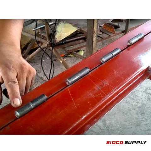 Installation of Beefy Heavy Duty Weldable Barrel Hinges 4 Pack 3 Inch By 3 Quarter Inch 15 Thirty Second Inch Pin on red metal door