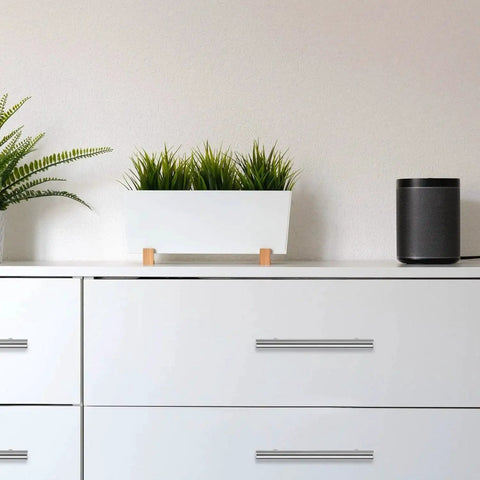 Modern dresser with 30 Pack 4 Inch Satin Nickel Cabinet Pulls, showcasing sleek design and functionality in a minimalist white decor.