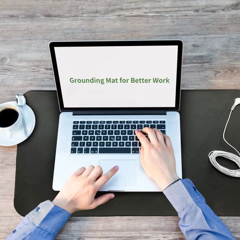 Person using laptop on grounding mat with Grounding Mat Kit 2 Pack With Grounding Cords And Wrist Straps For Better Sleep 10 By 26.7 Inches.