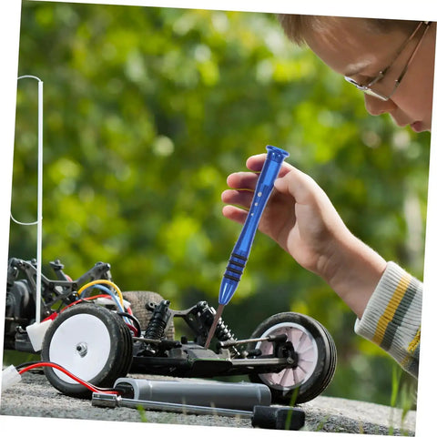 Child using wrench from Must-Have RC Car Screw And Bolt Kit For Quick Repairs And Routine Maintenance With Wrench Included on RC model