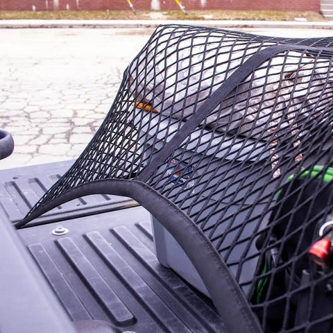 Elastic Cargo Net For Truck Bed And SUV Keeps Lightweight Loads In Place Without Tying Simple Mesh Organizer fits truck bed, close-up view.