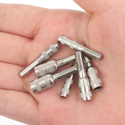 Hand holding 7 Piece Hex Socket Adapter Set With H4 Shank Metric Micro Socket Sizes 2.5mm Through 5.5mm for mini drills