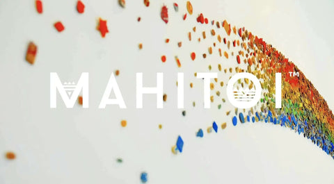 Colorful wave of small dots in rainbow hues on white background with "MAHITOI" text overlay.