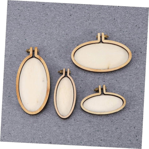 Four mini wood embroidery hoops with screws on a grey background. Models from the Five Piece Mini Wood Embroidery Hoops Set With Screws.