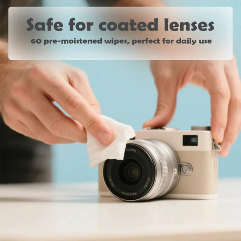 Person using Streak Free Lens Wipes For Glasses Phones And Cameras Quick Dry Safe For Coated to clean a camera lens.