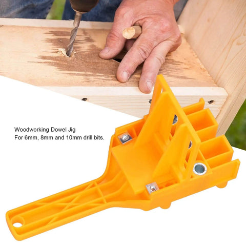 Pro Grade Dowel Jig For Woodworking With 6mm 8mm 10mm Drill Bit Guide And 0-50mm Scale, handheld tool in use on wood board