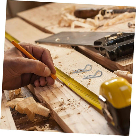 Hand marking wood with measuring tape and pencil, Versatile Cotter Pin Clips Set For Trailer Hitches And Equipment in view