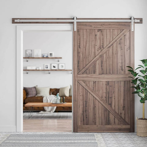 Wooden door using 8 Feet Brushed Nickel Barn Door Hardware Kit For 42 To 48 Inch Wide Panels Heavy Duty Sliding Track installed in home.
