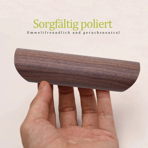 Hand holding Wooden Drawer Handles 4 Pack For Cabinet Cupboard Dresser And Wardrobe Drawers With 3.77 Inch Hole Distance in Black Walnut.