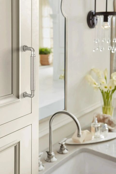 Collet 5-1/16 Inch Center-To-Center Polished Nickel Cabinet Pull on cabinet above kitchen sink