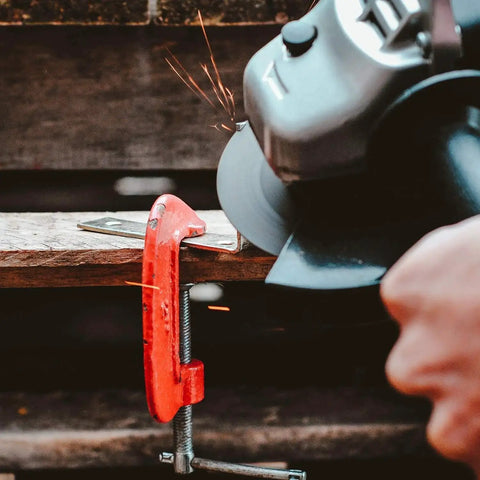 Angle grinder cutting metal with heavy duty flap discs set for metal wood concrete with four and a half inch size and seven eighths inch arbor