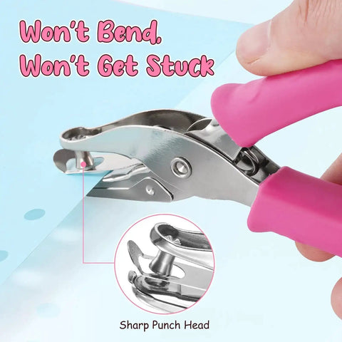 Sweet Two Size Hole Punch Set With Soft Grip Handle punching a paper; close-up of 1/4 inch hole; pink handle grip; for crafts and scrapbooks