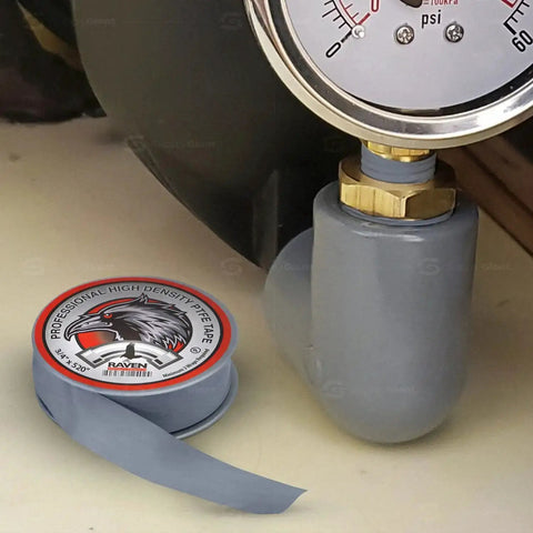 Pro Grade PTFE Thread Seal Tape For Plumbers White Gray Three Quarter Inch By Five Hundred Twenty Inches Pack Of Ten Rolls Leak Proof Easy To Apply Universal Pipe Thread Sealant For All Fittings Home Commercial Industrial Plumbing next to a gauge and pipe fitting.
