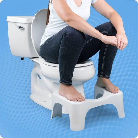 Person using Simple Curve 7 Inch White Bathroom Toilet Stool For Easy Squatting; stool in use for healthier posture.