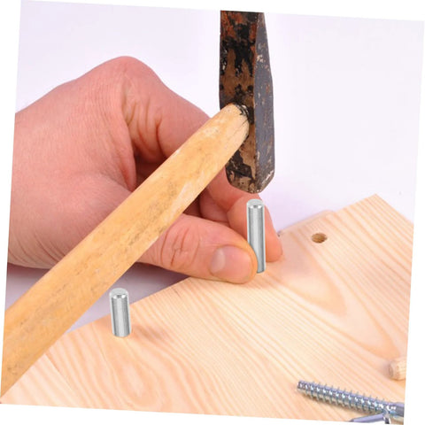 Person installing 100 Piece Stainless Steel Cylindrical Dowel Pins For Machinery Automotive And Electronics Durable Fastening Elements in wood.