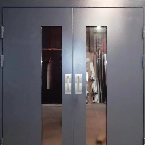 Double doors with stainless steel pull handles and plate installed, barn door hardware visible, handles 7 7/8 inch by 2 9/16 inch wide.