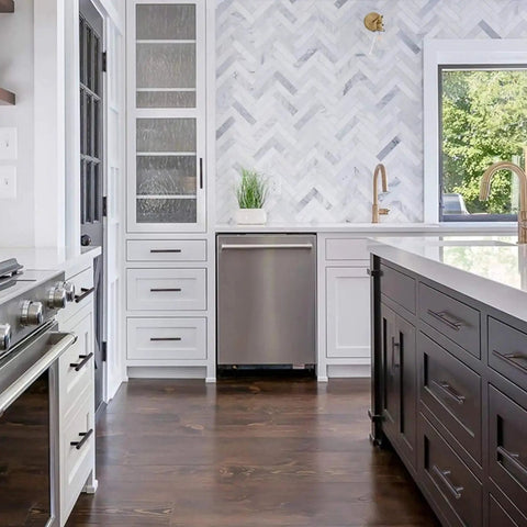 Modern kitchen with stainless steel appliances and cabinets featuring 30 Pack Solid Stainless Steel Cabinet Handles and Drawer Pulls With Oil Rubbed Bronze Finish 5.38 Inch Length 136mm 3 Inch Center to Center 1/2 Inch Diameter For Kitchen Cabinets and Furniture.