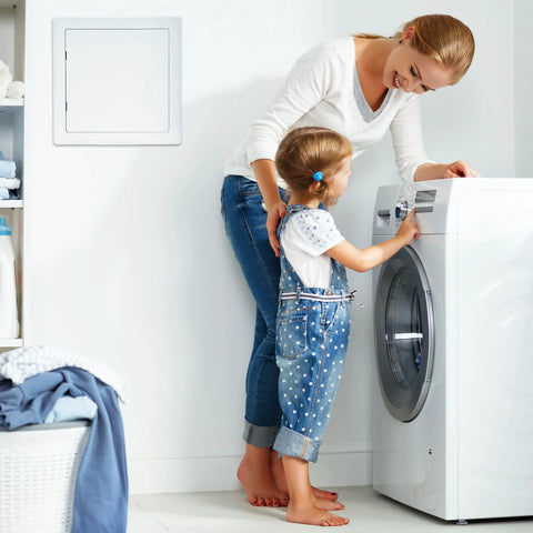 QWORK 10x10 inch plastic drywall access panel, white wall mount beside a front-load washing machine.