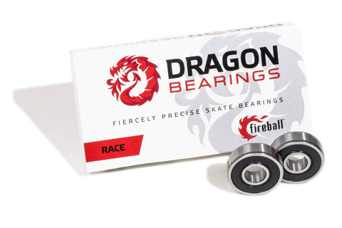 Dragon Bearings Fireball Race inline skate bearings, two silver steel bearings beside a white Dragon Bearings box