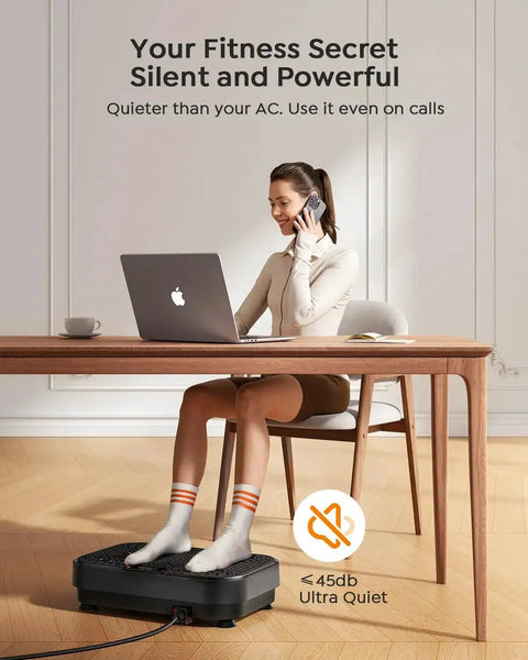 Woman using Full Body Vibration Plate For Home Workouts With 99 Adjustable Speeds under desk, talking on phone