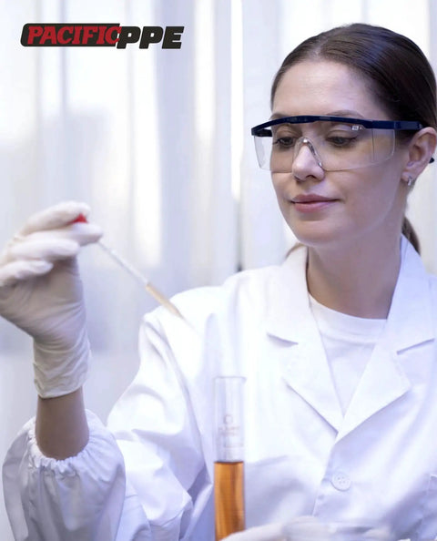 Scientist wearing 2 Pack Anti Fog Safety Glasses For Men And Women With ANSI Z87 UV Protection working in a lab.