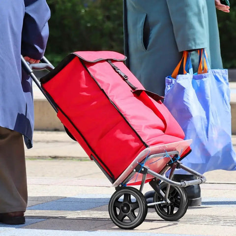 Red trolley cart equipped with 2 Pack Heavy Duty Shopping Cart Wheels Replacement For Trolley Carts Compact Lightweight Casters with Stair Climbing Design.