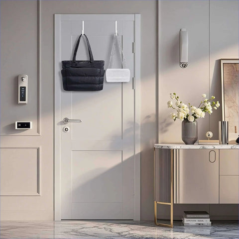 Elegantly decorated hallway with modern door, electronic lock, and stylish console table with flowers